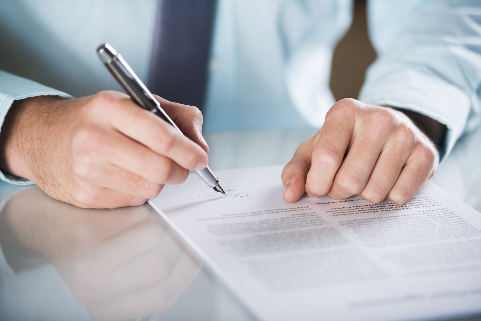 Man signing a document